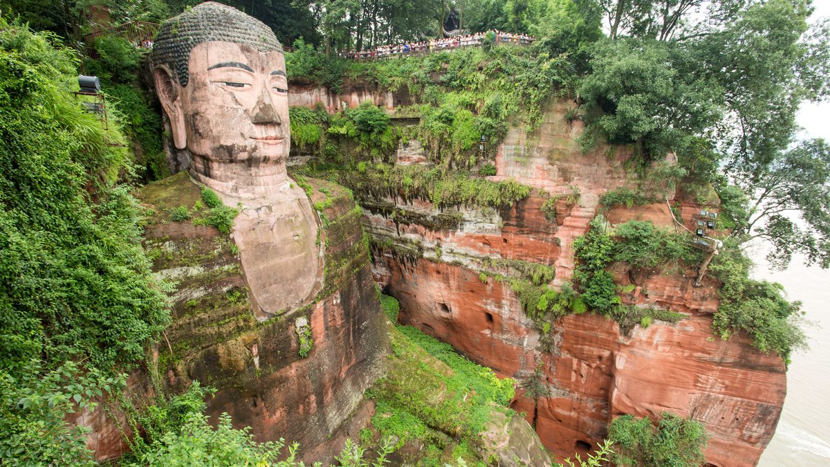 The Leshan Giant Buddha carved into the river cliff, seen from the clifftop path