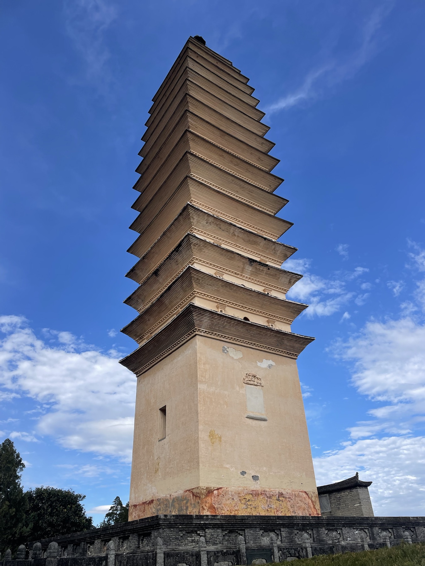 Close view of one of the Chongsheng Temple pagodas against a blue sky