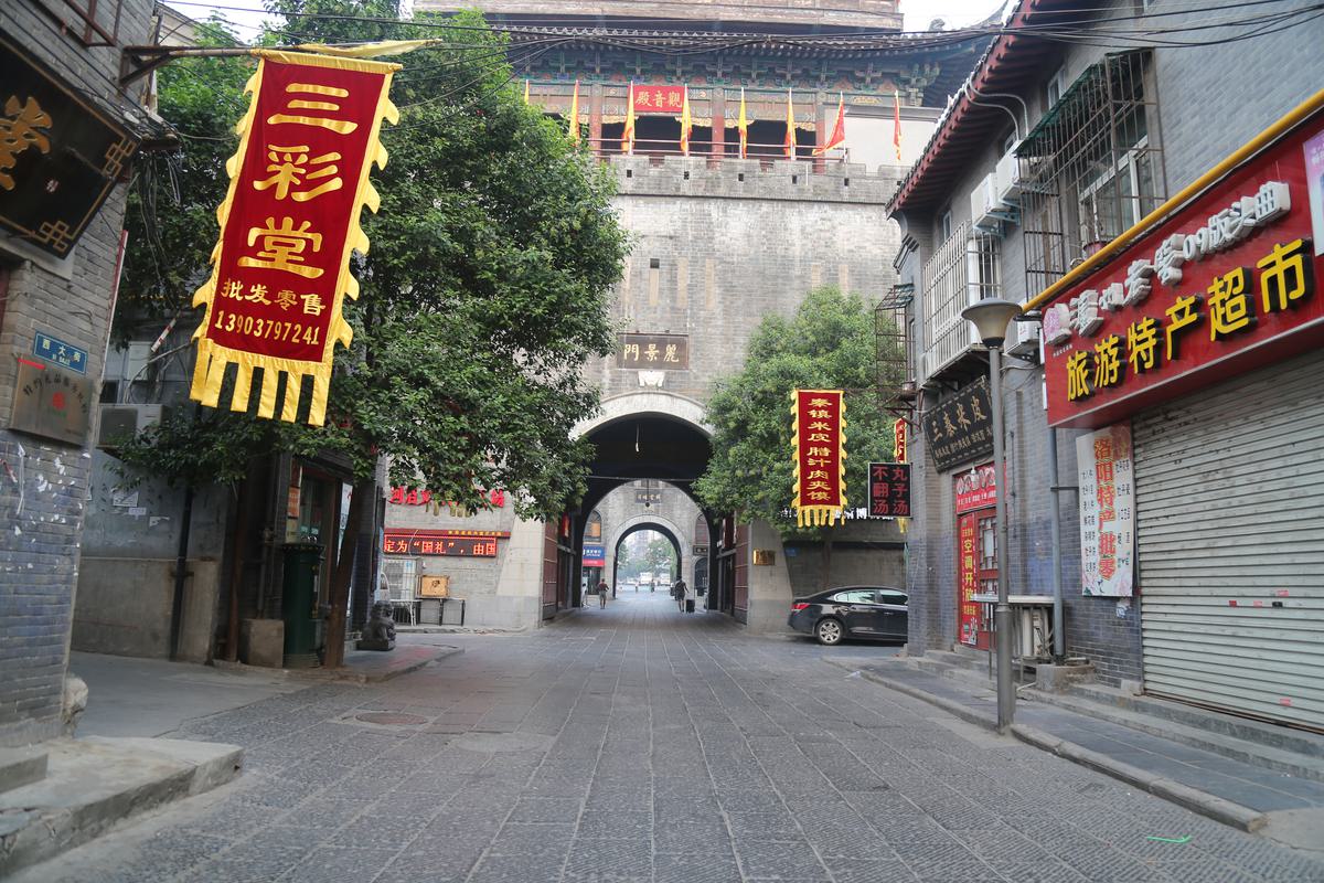 The rebuilt Lijing Gate rising over the old city moat in Luoyang